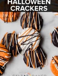 White, black, and orange covered Ritz crackers on a white background.