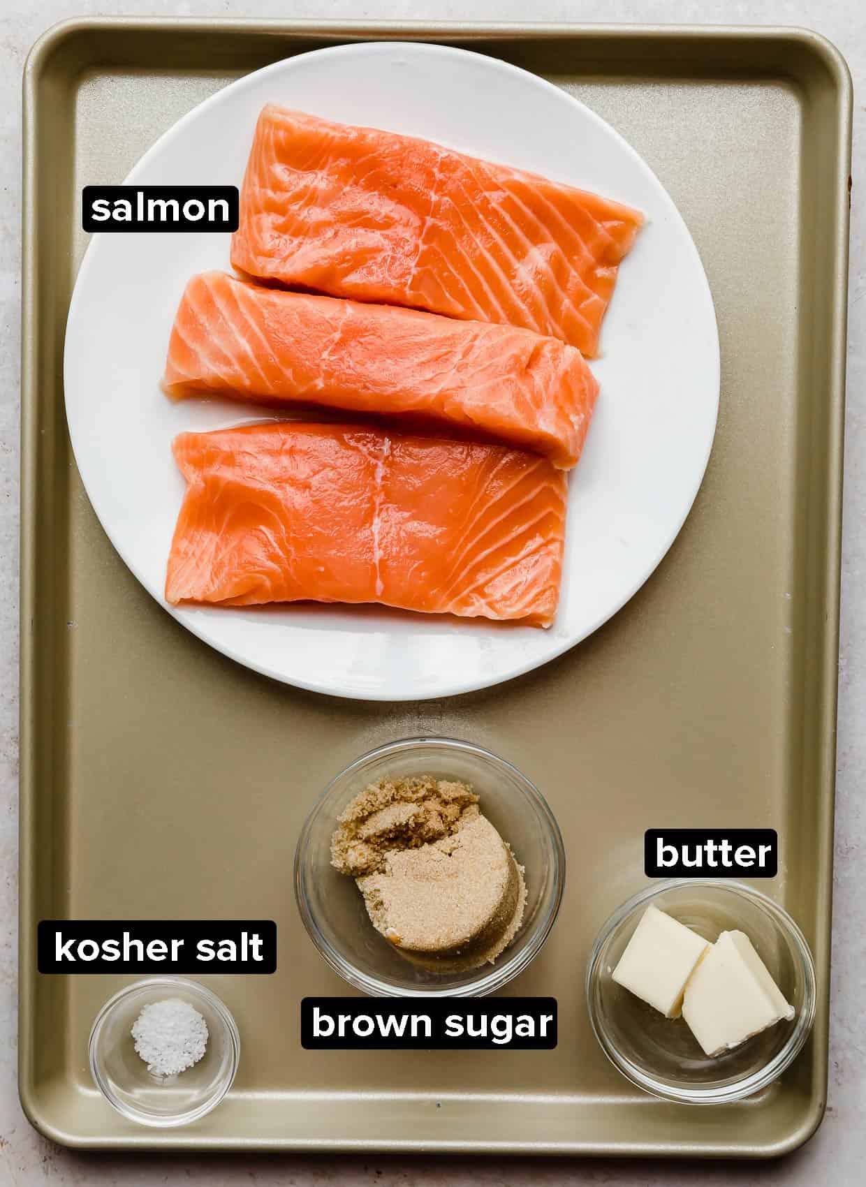 Brown Sugar Salmon ingredients on a bronze baking sheet.