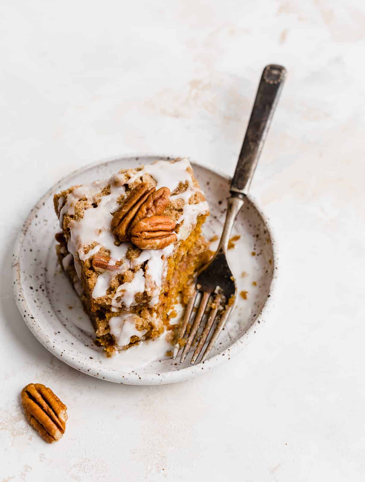Glazed Pumpkin Coffee Cake topped with 2 pecans.