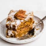 Pumpkin Coffee Cake on a white plate with a fork.