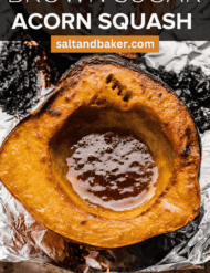Roasted acorn squash with brown sugar on a baking sheet, with the words, "Brown Sugar Acorn Squash" written in white text above the photo.