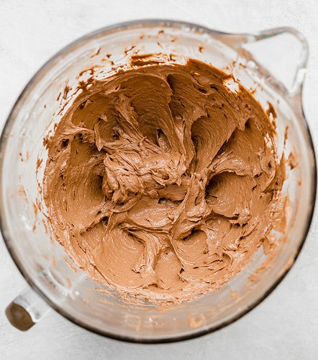 A glass mixing bowl with French silk pie, after adding 1 egg to the mixture.