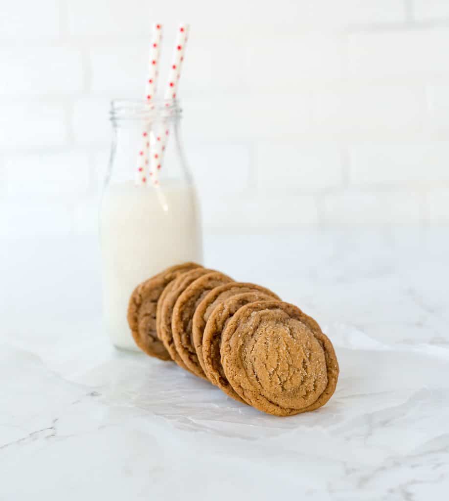 Gingersnap cookies and a glass of milk.