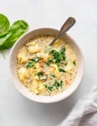 Bowl of sausage tortellini soup.