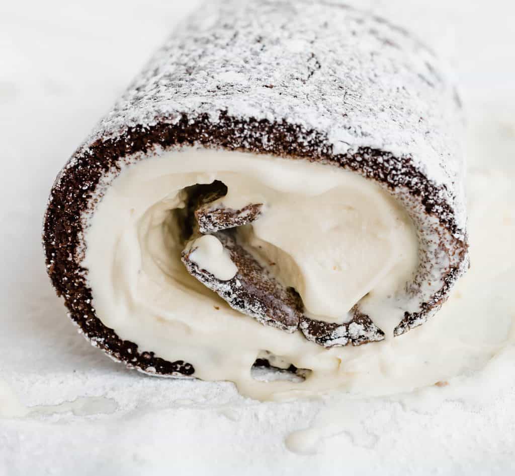 Chocolate Ice Cream Cake Roll rolled up with ice cream melting out of the sides. 
