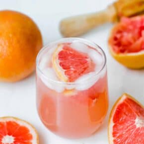 Grapefruit Italian Soda with a grapefruit wedge in the drink.