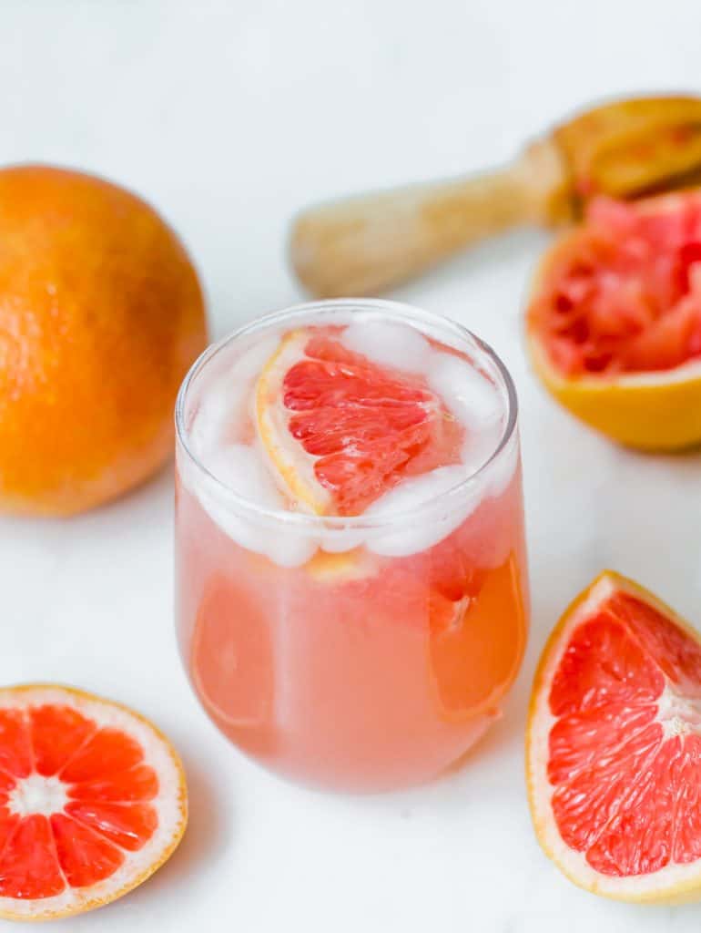 Grapefruit Italian Soda with a grapefruit wedge in the drink.