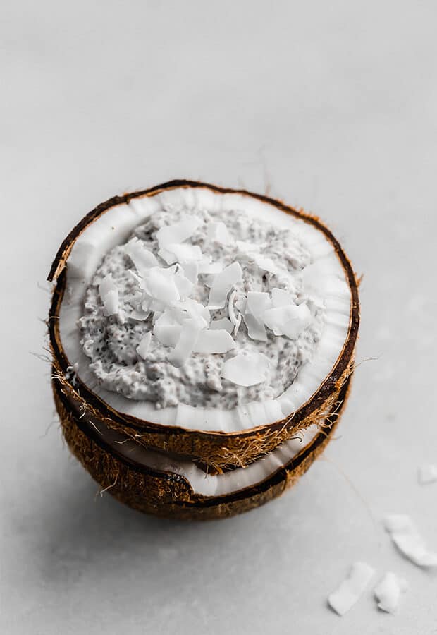 Overnight Coconut Chia Pudding inside half of a real coconut.