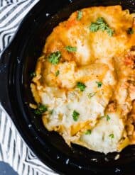Overhead view of the slow cooker lasagna recipe, with a garnish of parsley.