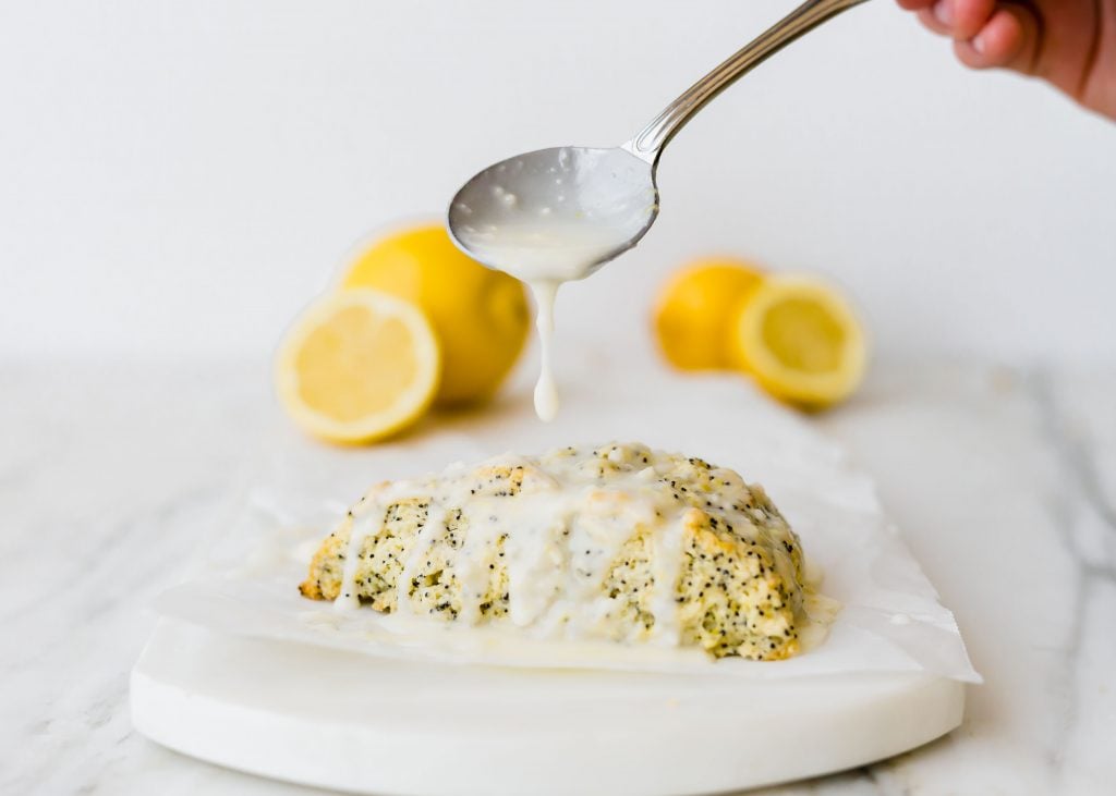 These Lemon Poppy Seed Scones are the perfect spring and summer treat! They are loaded with the perfect lemon flavor and topped with an irresistible glaze! 