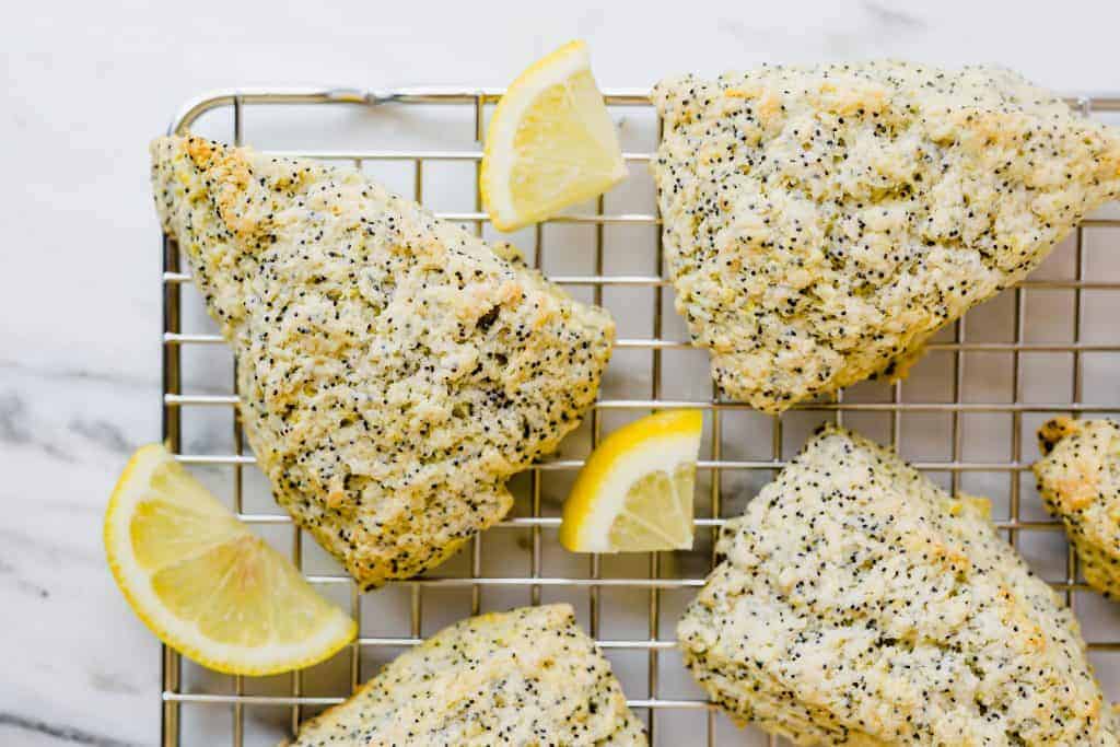These Lemon Poppy Seed Scones are the perfect spring and summer treat! They are loaded with the perfect lemon flavor and topped with an irresistible glaze! 