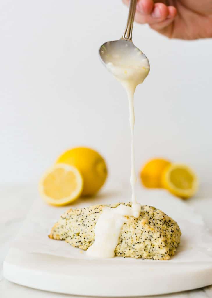 These Lemon Poppy Seed Scones are the perfect spring and summer treat! They are loaded with the perfect lemon flavor and topped with an irresistible glaze! 