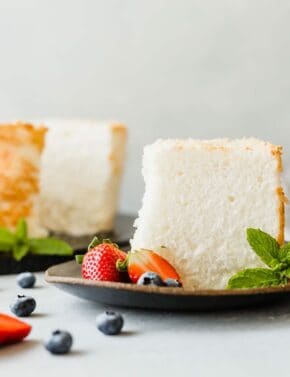 An easy to make Angel Food Cake Recipe that's soft, fluffy, and rich in flavor! Add fruit and whipped cream and you've just made the perfect dessert!