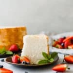 An easy to make Angel Food Cake Recipe that's soft, fluffy, and rich in flavor! Add fruit and whipped cream and you've just made the perfect dessert!
