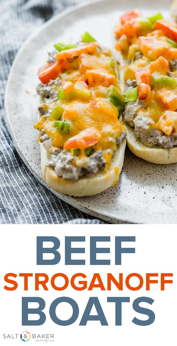These Beef Stroganoff Boats are easy to make and require very little prep and cooking time! These delicious sandwiches are topped with a creamy and flavorful beef stroganoff, freshly diced green bell peppers, diced tomatoes, and a layer of shredded cheddar cheese. It'll be your new go-to 30 minute meal! Get the full recipe at saltandbaker.com #saltandbaker #beefstroganoff #sandwiches #30minutemeal #kidfriendlymeals