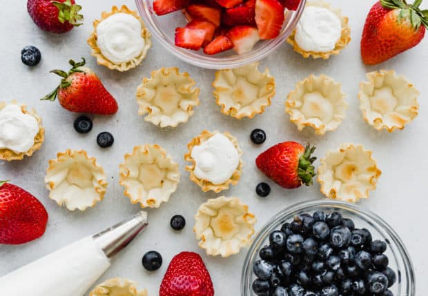 Overhead view of Fillo shells, some with whipped cream inside, and some empty. 