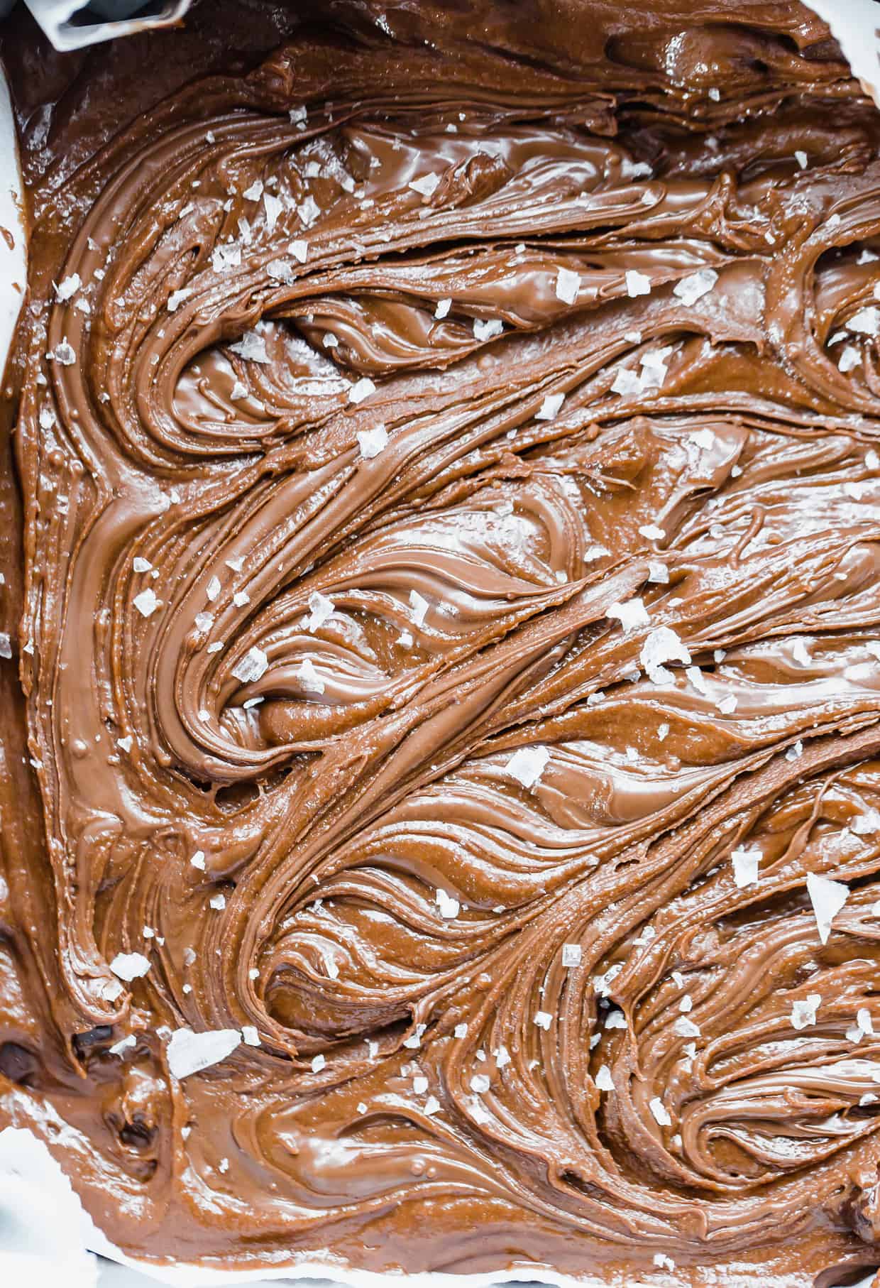 Nutella Brownies with Nutella swirled into the unbaked batter, with a sprinkle of flaky sea salt on the surface.