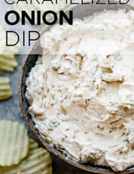 A bowl full of caramelized onion dip with ruffled potato chips surrounding the bowl.