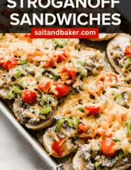 Beef Stroganoff Sandwiches topped with tomatoes, peppers, and cheese with the words, "Stroganoff sandwiches" in white text over the top of the image.