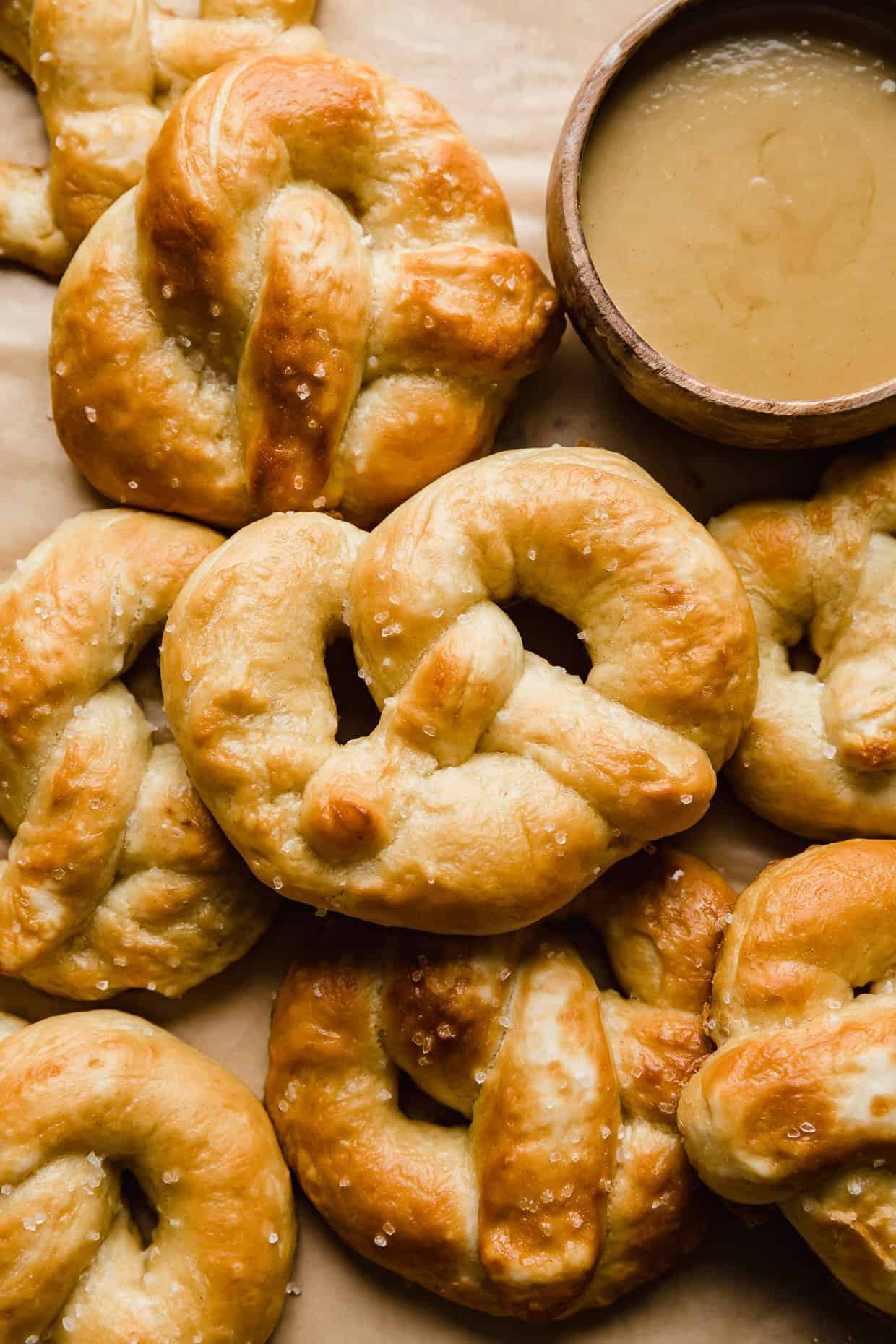 Homemade Soft Pretzels on a tan parchment paper. 