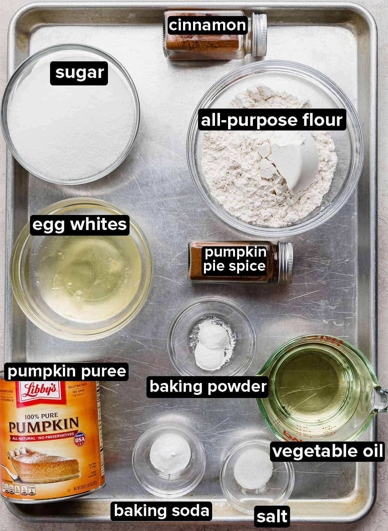 Pumpkin Bars ingredients using Libby's pumpkin puree portioned into glass bowls on a metal baking sheet.