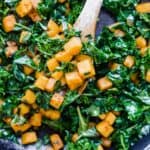 A close up photo of cubed Butternut Squash and Kale.