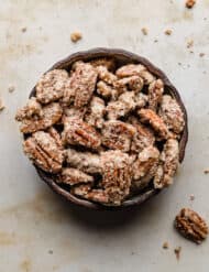 Sugared Candied Pecans in a black bowl.