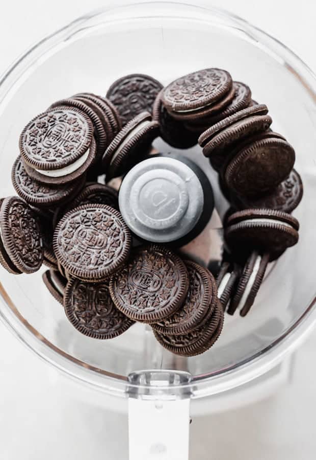 A food processor full of Oreos, in preparation to make Oreo balls.