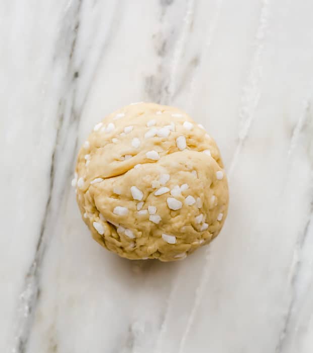 A ball of liege waffle dough with Belgian pearl sugar dispersed throughout.