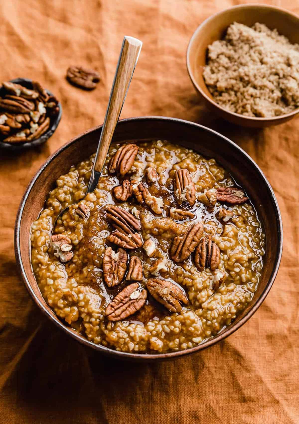 Pumpkin Steel Cut Oats topped with pecans and brown sugar.