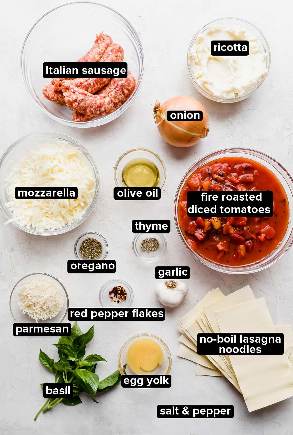 Cast Iron Skillet Lasagna ingredients laid out on a gray background.