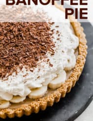 Banoffee Pie made of a graham cracker crust with toffee, banana, and whipped cream.