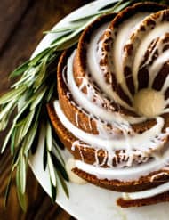 Overhead photo of a gingerbread bundt cake topped with a maple glaze.