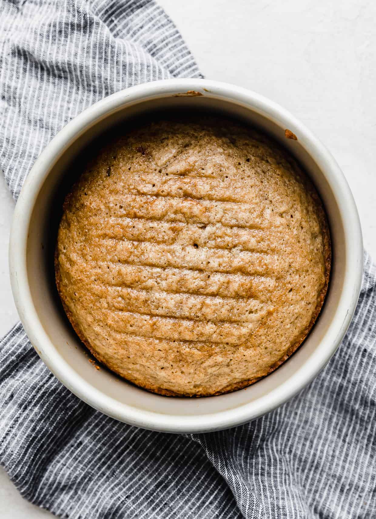 A baked Spice Cake in a round cake pan.