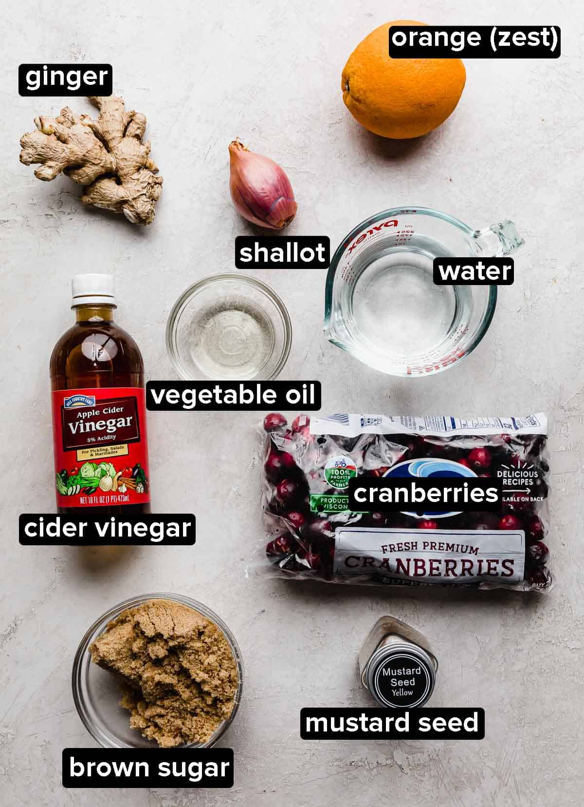 Cranberry chutney ingredients on a light gray background.