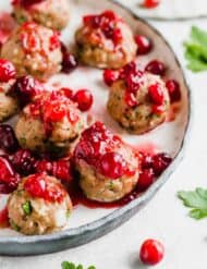 Baked turkey meatballs topped with cranberry chutney sauce.
