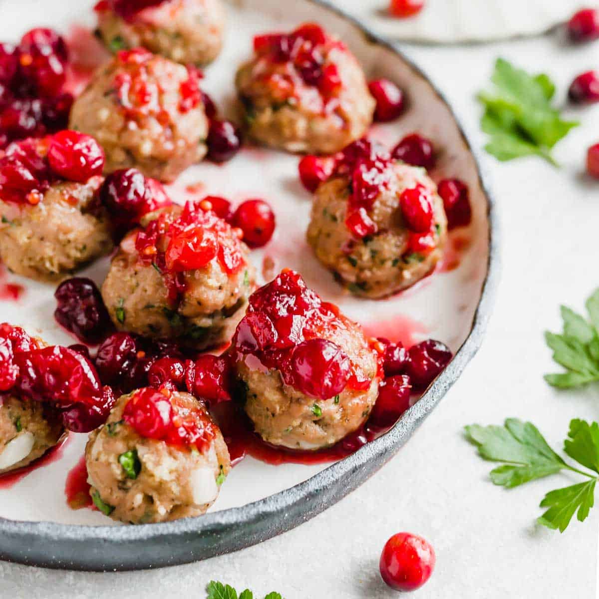 Baked turkey meatballs topped with cranberry chutney sauce.