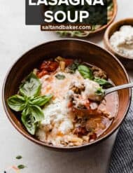 A bowl of cheesy sausage lasagna soup with the words, "Lasagna Soup" written in white text over the image.