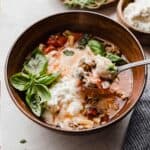 Lasagna Soup with ricotta in a brown bowl.