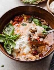 Lasagna Soup with ricotta in a brown bowl.
