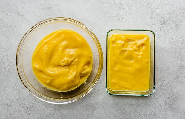 Two glass bowls of mango sorbet puree prior to freezing and churning.