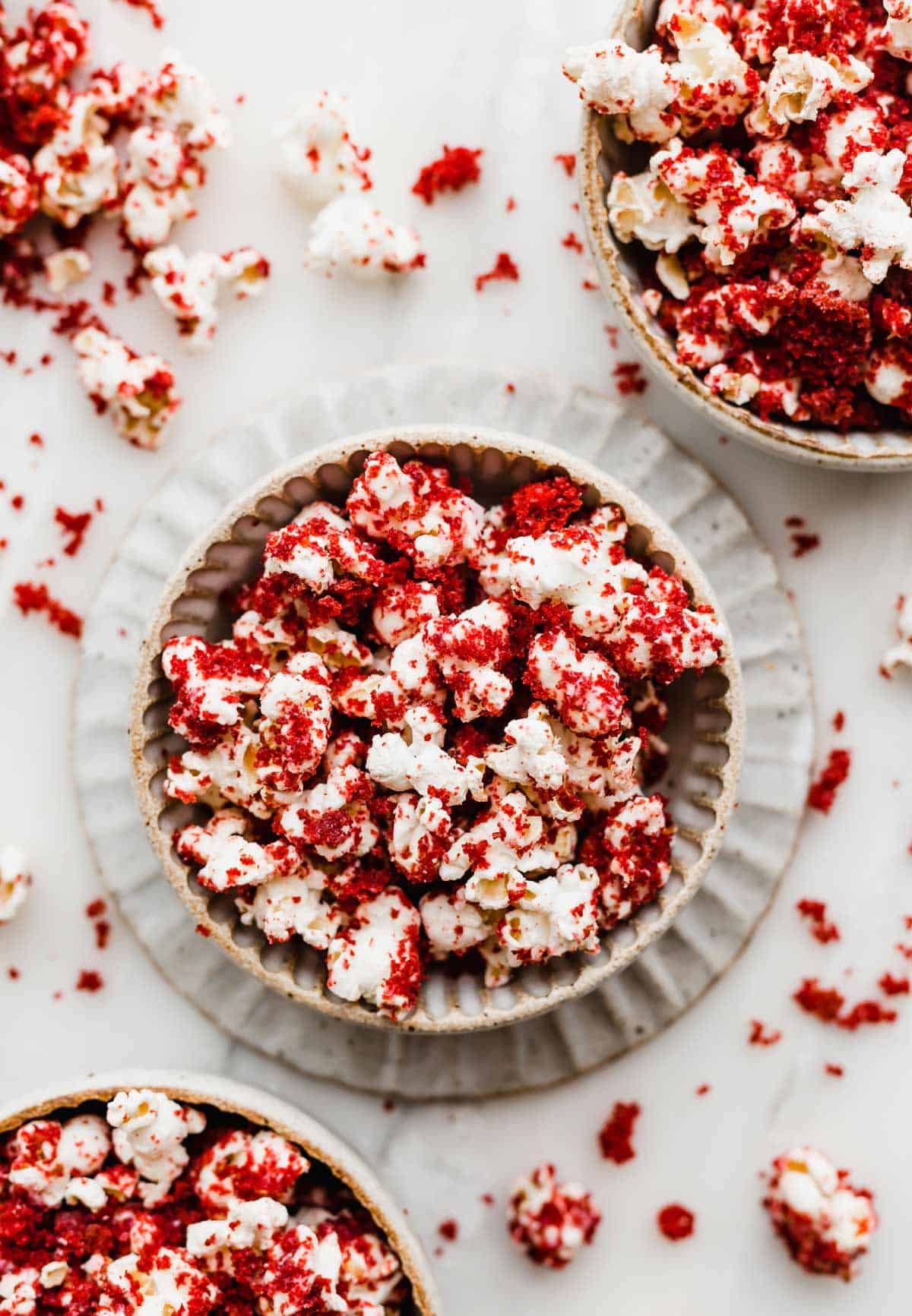 Red Velvet Popcorn in a bowl on a white background.