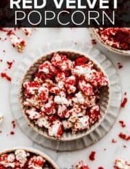 Red Velvet Popcorn in a bowl with the words, "Red Velvet Popcorn" written in white text over the photo.