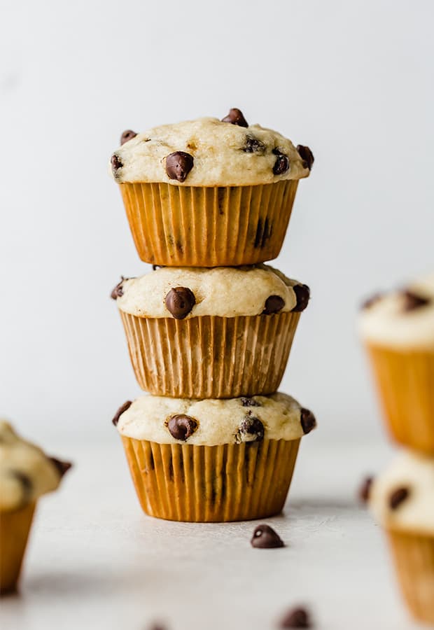 A stack of three banana chocolate chip muffins.
