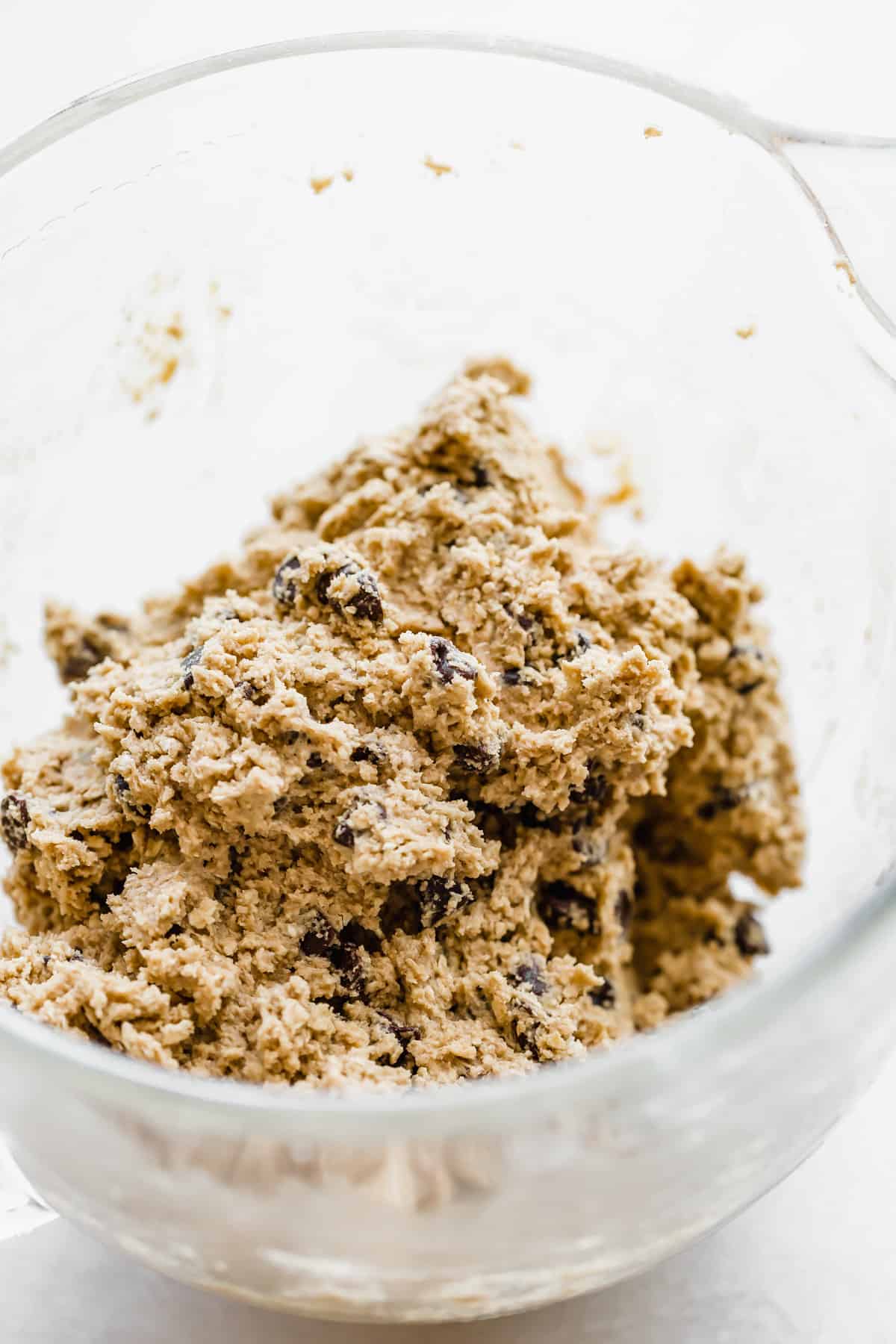 Brown Butter Chocolate Chip Cookie dough in a glass stand mixer bowl.