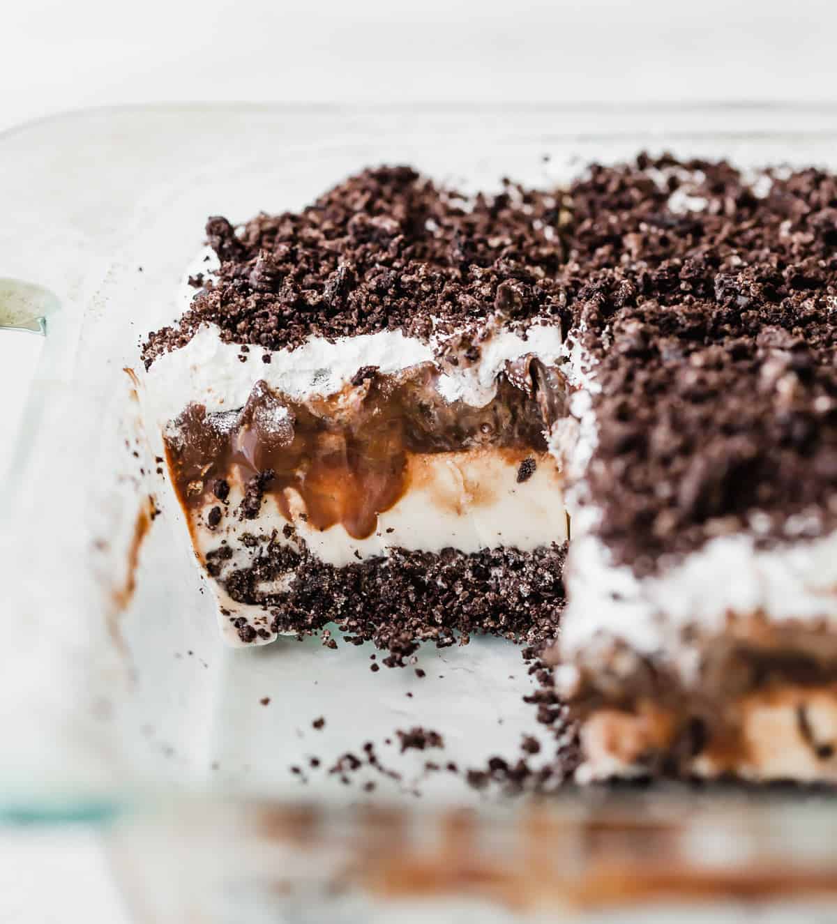 Oreo Ice Cream Cake in a glass baking dish against a white background.