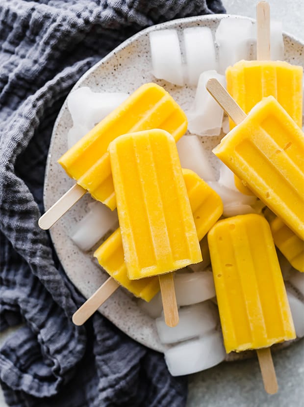 A pile of pineapple mango popsicles. 