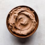Chocolate Buttercream Frosting Recipe made with melted chocolate in a brown bowl.