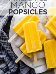 A pile of pineapple mango popsicles.