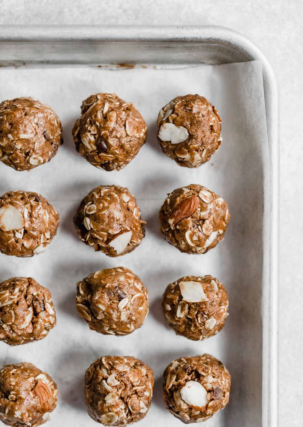 A baking sheet lined with healthy almond joy bites.